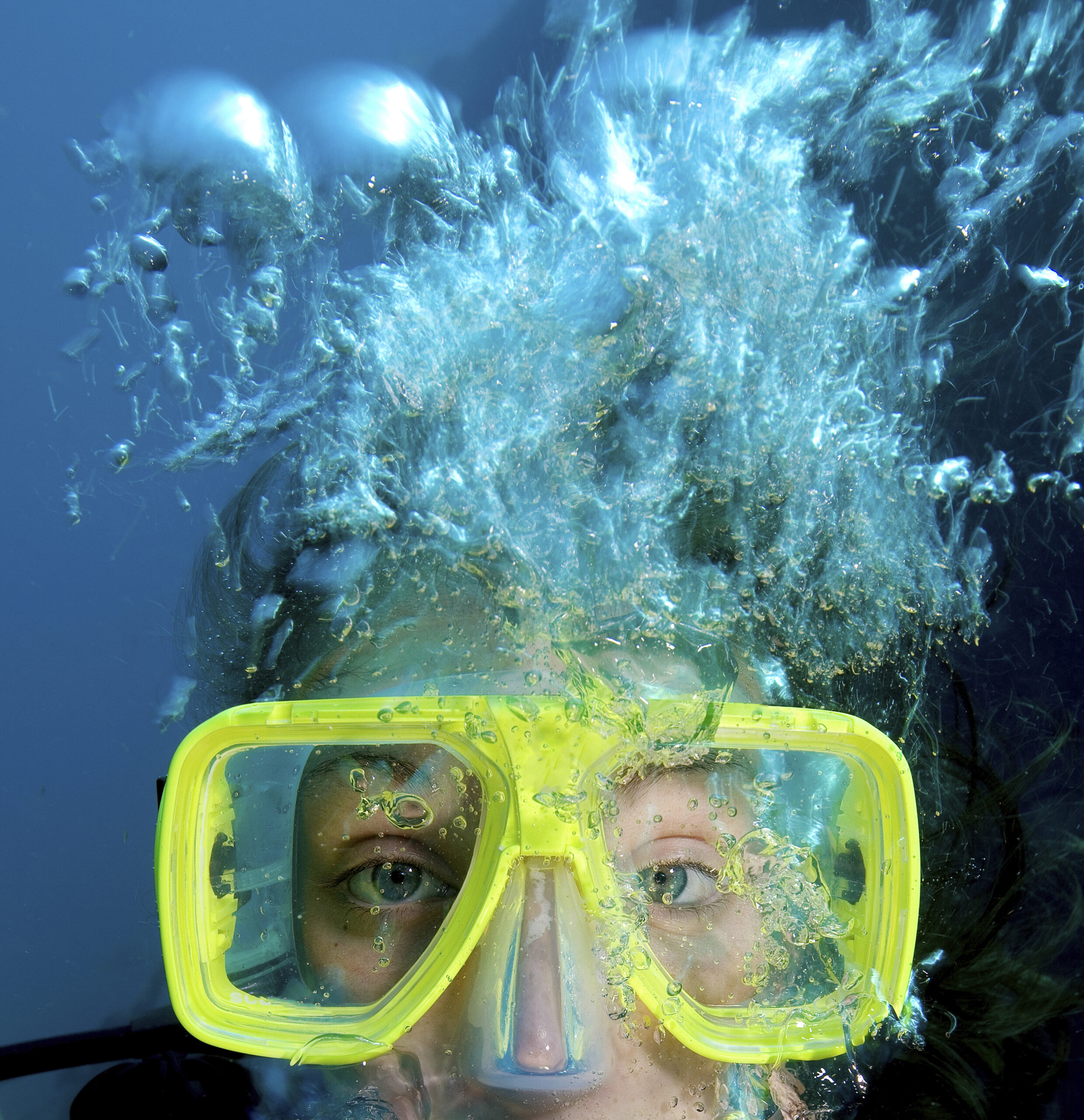 Close up of teenager's face while scuba diving.,United States